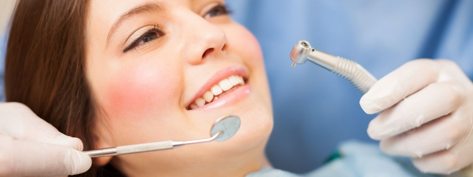 happy patient at dentist doing a filling