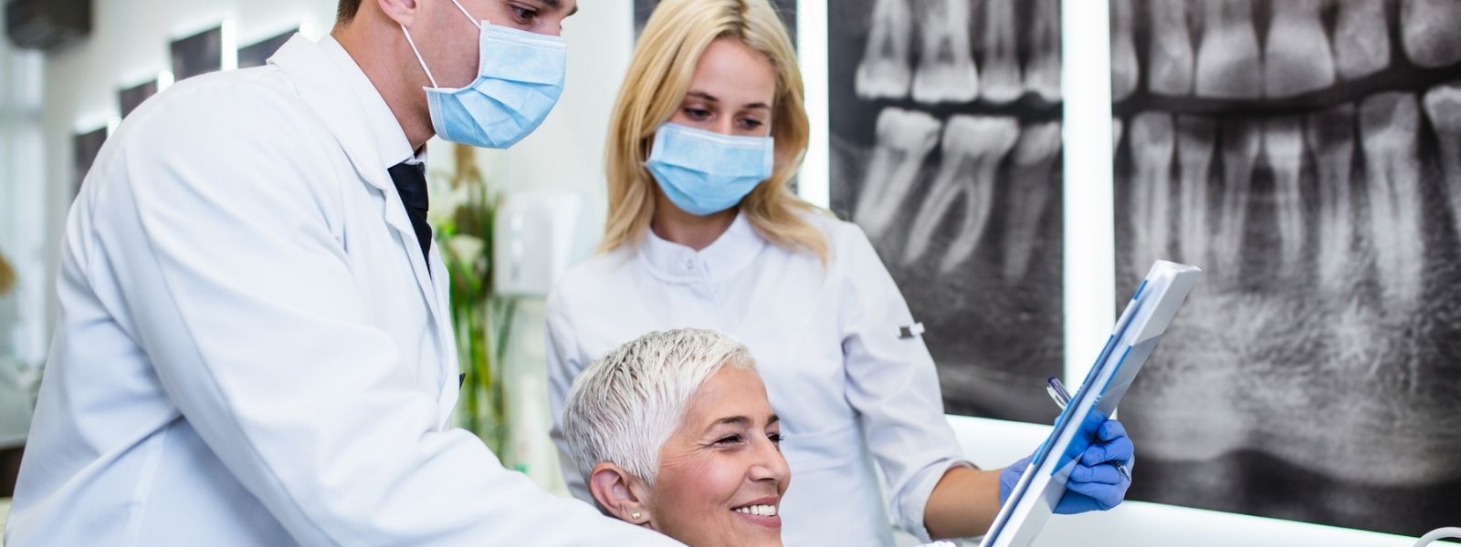 dentists consulting a patient