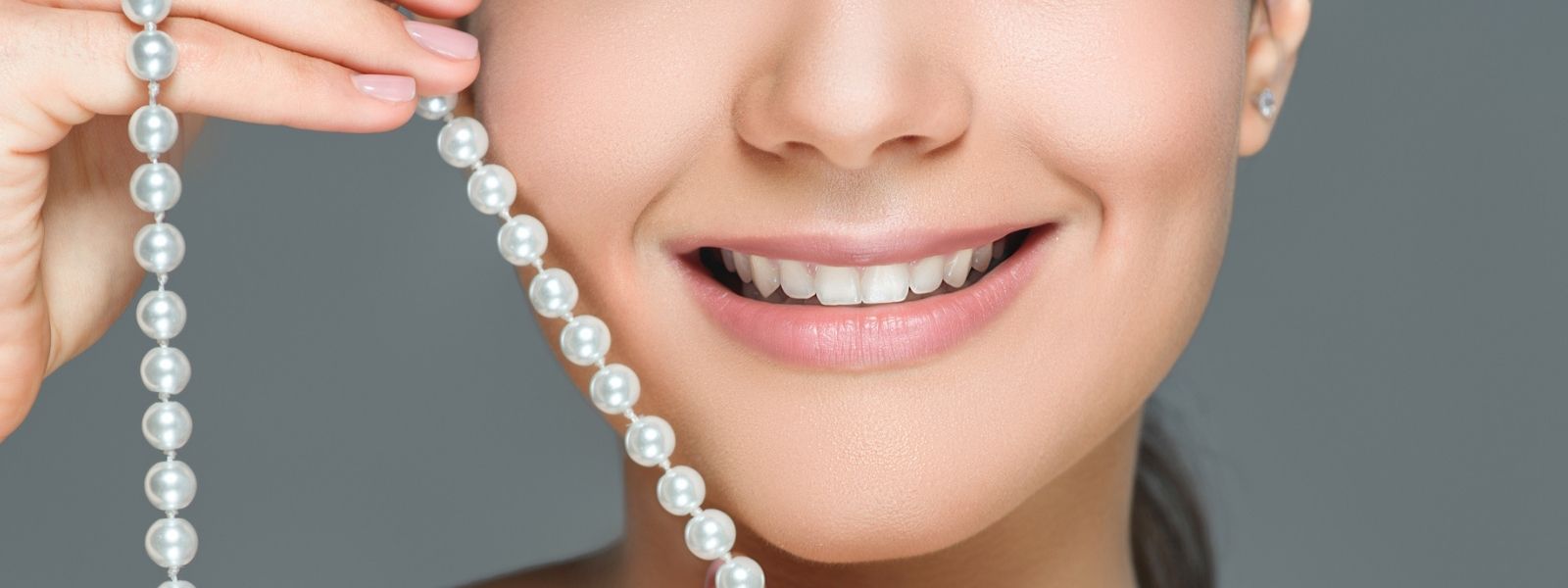 smiling girl with pearls string